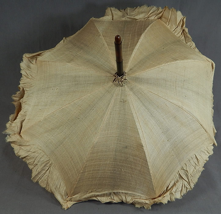 Victorian Civil War Pongee Raw Silk Folding Ebony Handle Marquis 
There is a black ebony wood carved handle and folding shaft, with a marquis tilt top mechanism inside to keep the sun off your face and is unlined.Parasol