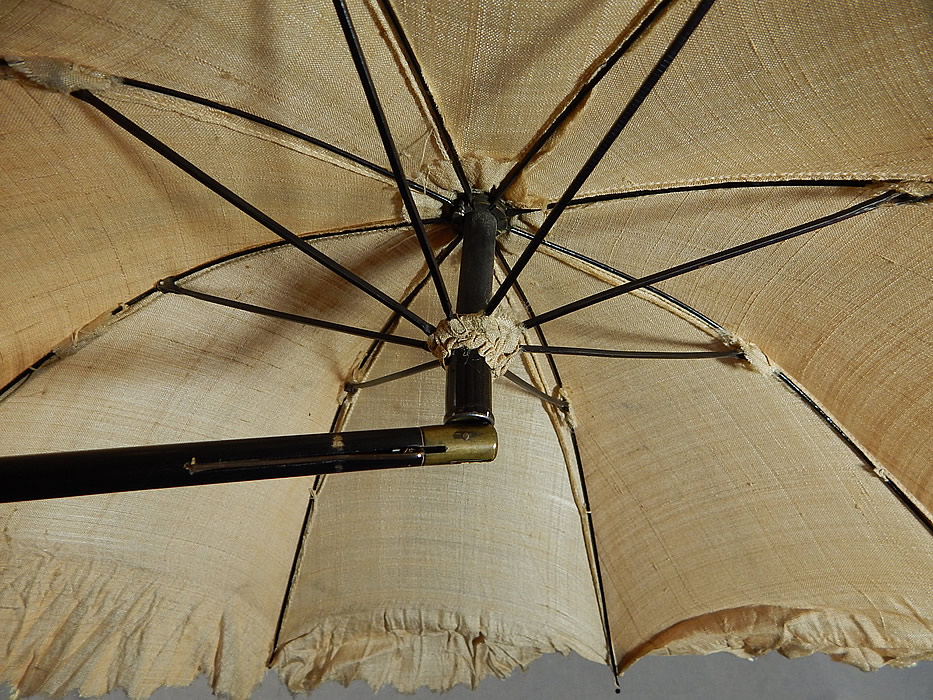 Vintage Victorian Civil War Era Pongee Raw Silk Folding Ebony Handle Marquis Parasol
It is in good working order condition, with only some slight fraying along the silk edging. This is truly a rare and wonderful antique Victoriana parasol!