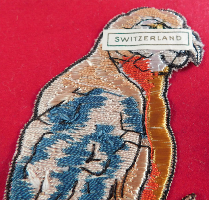 Vintage Unused Swiss Colorful Silk Embroidered Parrot Bird Patch Applique Trim
This pretty parrot bird perched on a branch patch applique would have been used as millinery or dress trim, it is unlined, not backed and has a made in "Switzerland" paper label on the back. The patch measures 6 inches long and 2 inches wide. It is in excellent unused condition. This is truly a wonderful piece of bird lovers wearable art! 
