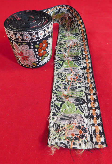 Vintage Asian Colorful Silk Damask Weave Floral Bird Polka Dot Ribbon Trim
This vintage Asian colorful silk damask weave floral bird polka dot ribbon trim dates from the 1930s. It is made of black silk background with colorful silk thread damask weave with woven flowers, birds and white polka dots motif pattern and a decorative border trim edging along the top. 
